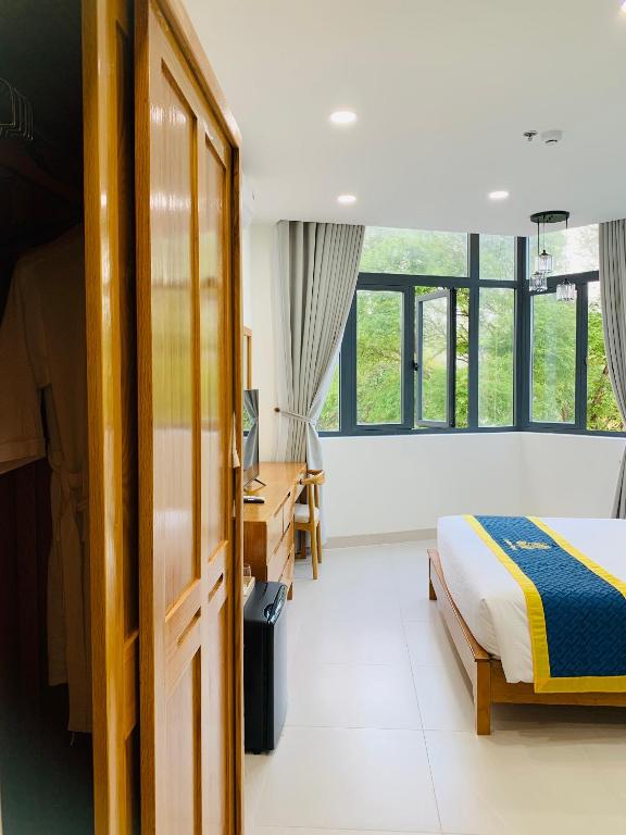 Postel nebo postele na pokoji v ubytování Golden Rose Hotel