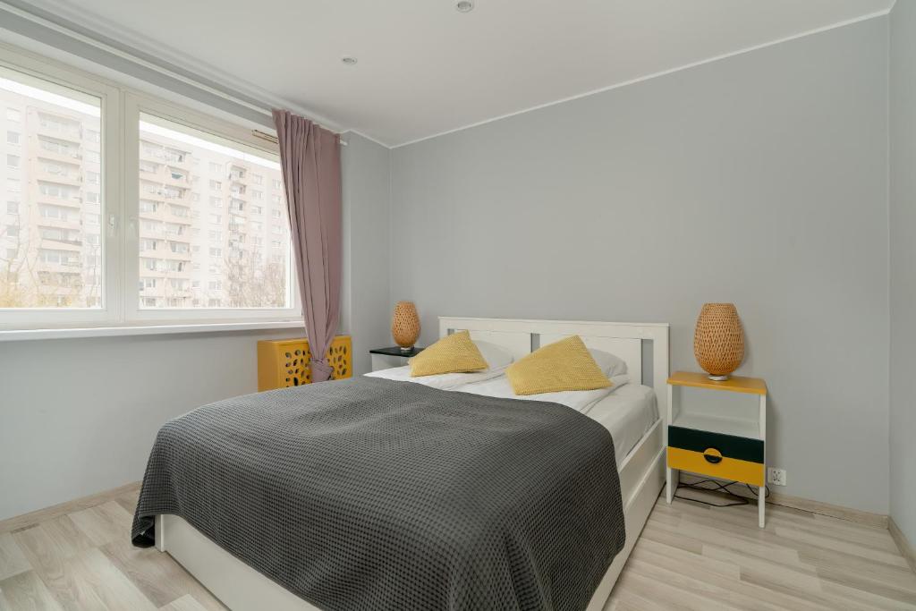Posteľ alebo postele v izbe v ubytovaní Family Apartments Osiedle Rusa by Renters