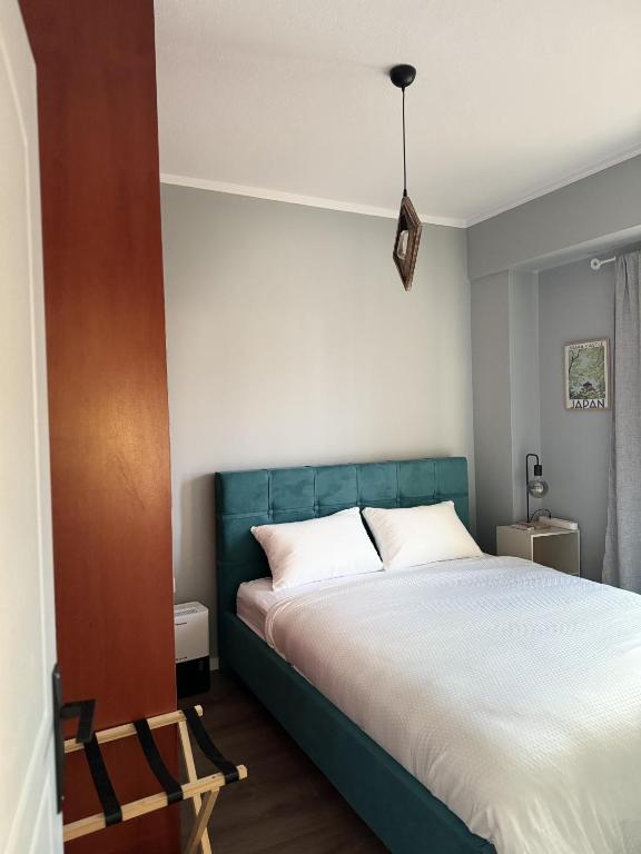 Postel nebo postele na pokoji v ubytování Uddo Apartment
