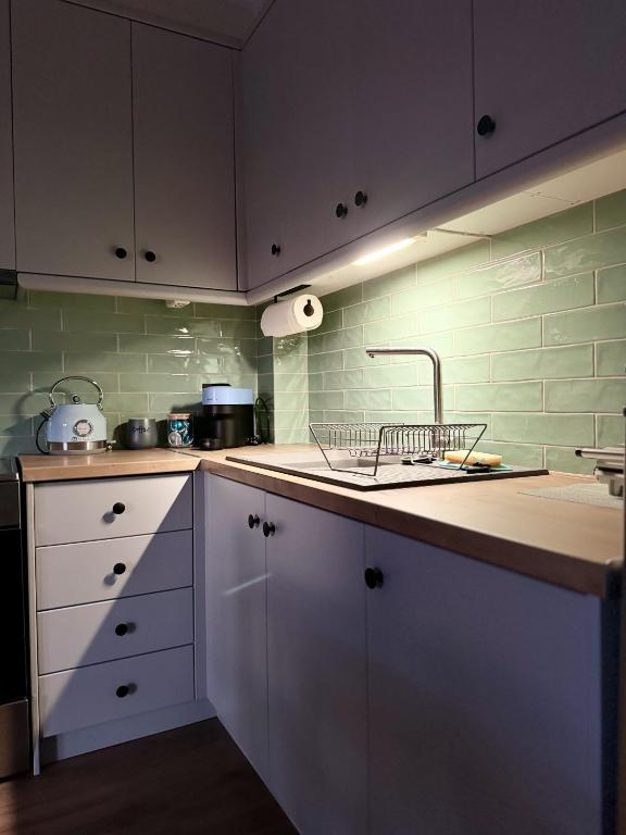 Kuchyň nebo kuchyňský kout v ubytování Uddo Apartment