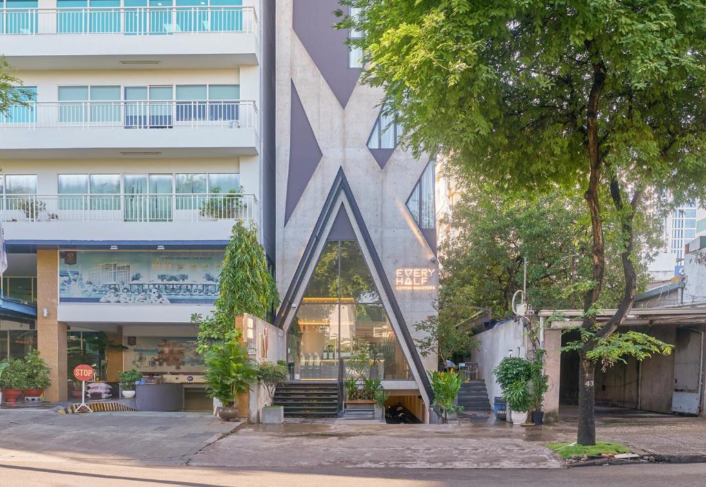 a building with a large star on the side of it at M Village Nguyễn Văn Thủ in Ho Chi Minh City
