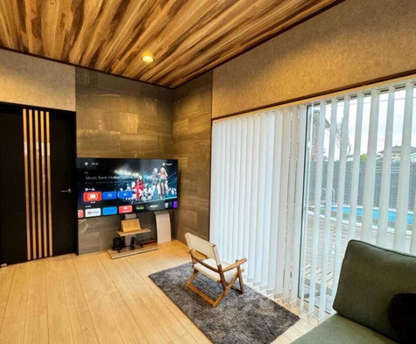 TV a/nebo společenská místnost v ubytování The No.10 Sunrise Beach 九十九里