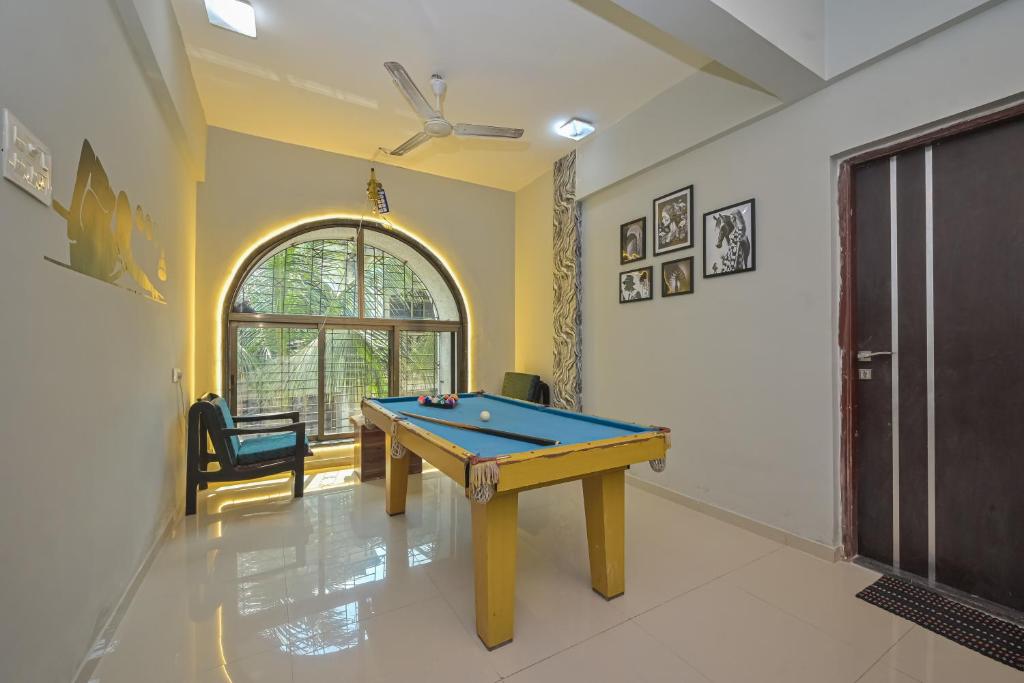 a living room with a pool table in it at EMPYREAN STAY ll 3BHK JIMMY VILLA ll SWIMMING POOL II AC II BBQ II POOL TABLE II LUXURY in Lonavala