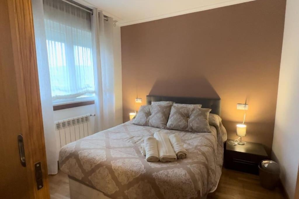 Llit o llits en una habitació de Apartamento Santiagos Road