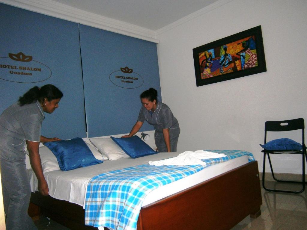 Postel nebo postele na pokoji v ubytování Hotel Shalom PHE Guaduas