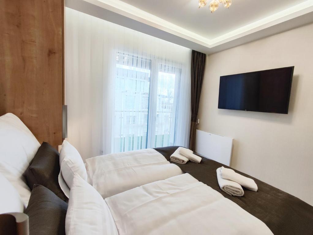 A bed or beds in a room at Royal Martin's Apartment