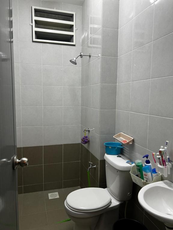 a bathroom with a toilet and a sink at Amaris Homestay in Sungai Petani
