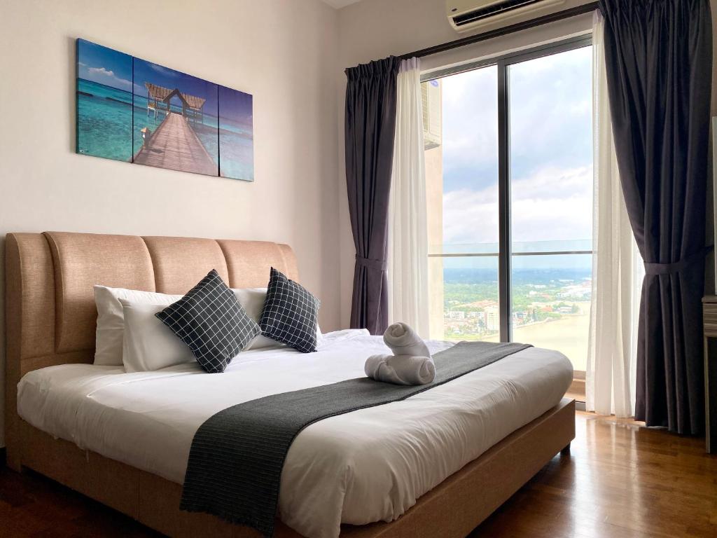 Ліжко або ліжка в номері Vesta Home @ Silverscape Residence Melaka