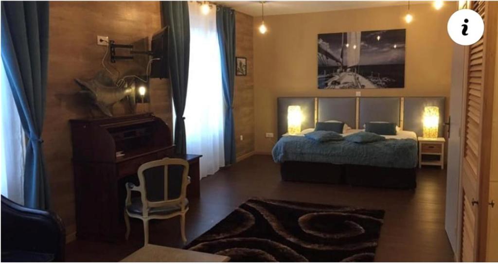 Postel nebo postele na pokoji v ubytování Logis Hôtel & Restaurant - Le Mouton Blanc