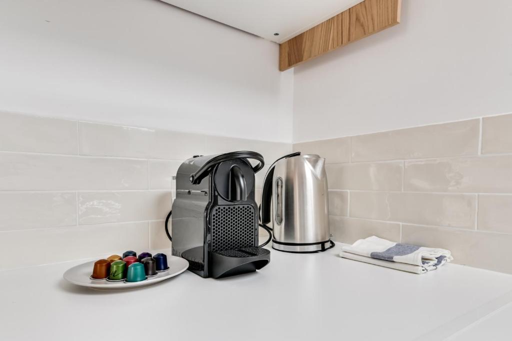 a toaster sitting on a counter in a kitchen at 235 Home Madrid Concept in Paris