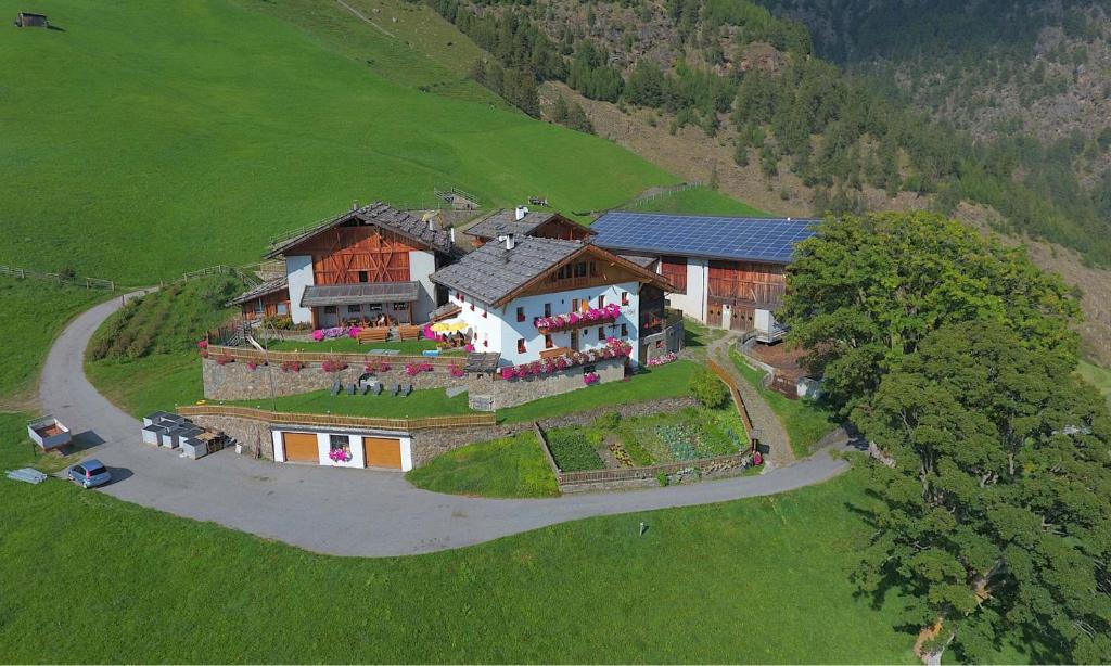 an aerial view of a house on a hill at Schnatzhof Apartment Adlerhorst in Naturno