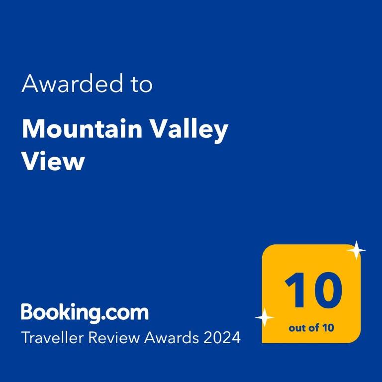 a yellow sign with the number on it at Mountain Valley View in Buşteni