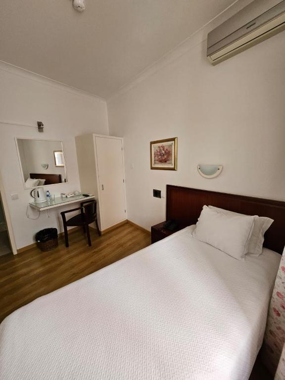Postel nebo postele na pokoji v ubytování Hotel Beira Mar