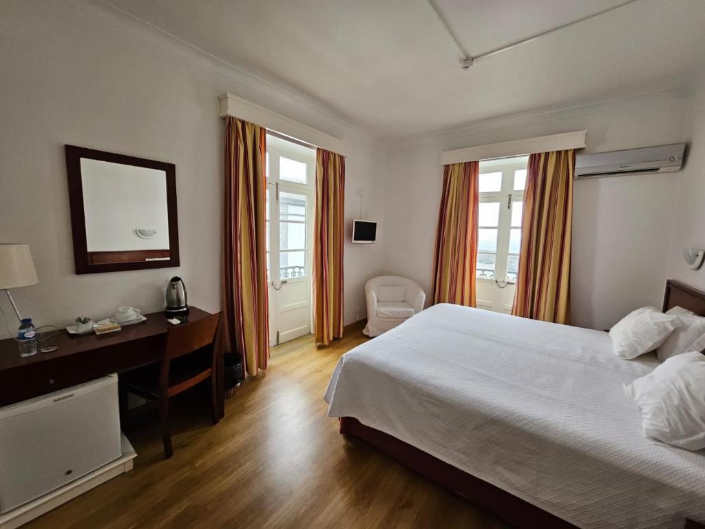 Postel nebo postele na pokoji v ubytování Hotel Beira Mar