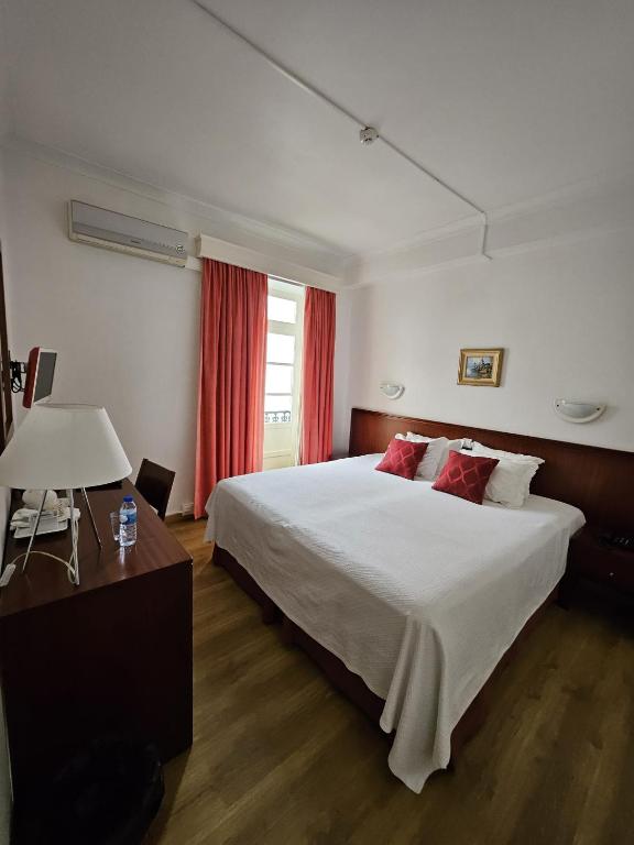 Postel nebo postele na pokoji v ubytování Hotel Beira Mar