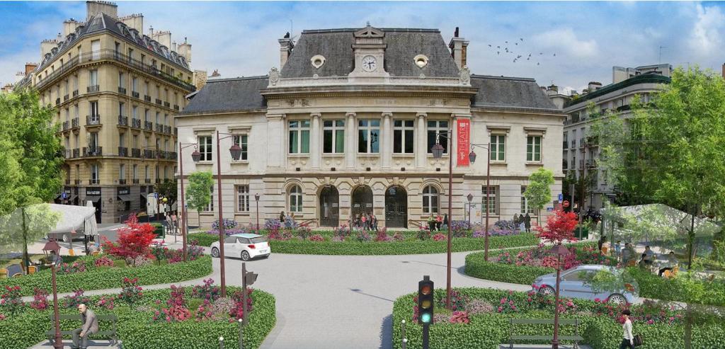 ヌイイ・シュル・セーヌにあるBel Appartement 2 pièces à Neuilly Porte Maillot !の時計塔のある建物