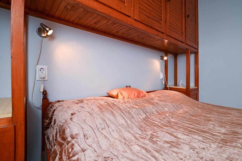 Postel nebo postele na pokoji v ubytování Vár-Lak Apartman