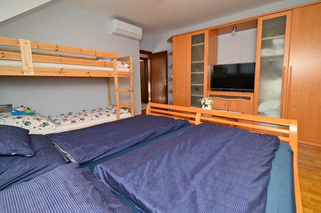 Postel nebo postele na pokoji v ubytování Vár-Lak Apartman