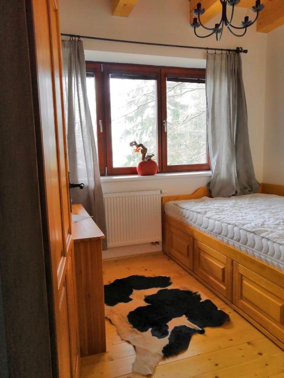 Postel nebo postele na pokoji v ubytování Nadgalerii Soláň