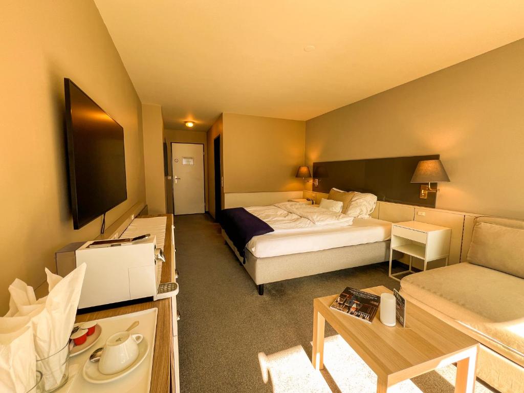 Postel nebo postele na pokoji v ubytování Seehotel Riviera at Lake Lucerne