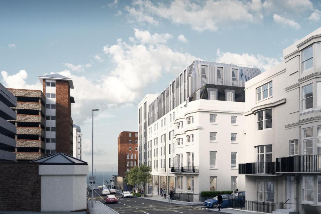 a group of buildings on a city street at Maldron Hotel Brighton City Centre in Brighton & Hove