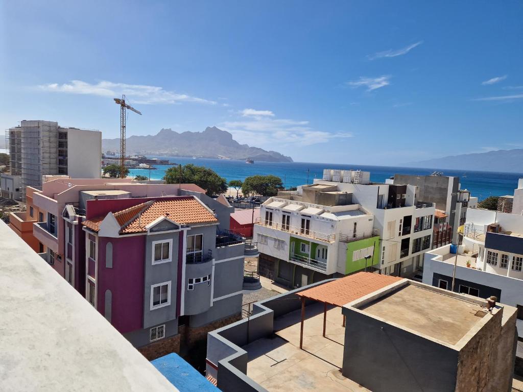 an aerial view of a city with buildings and the ocean at Apartamentos Beira-Mar in Mindelo