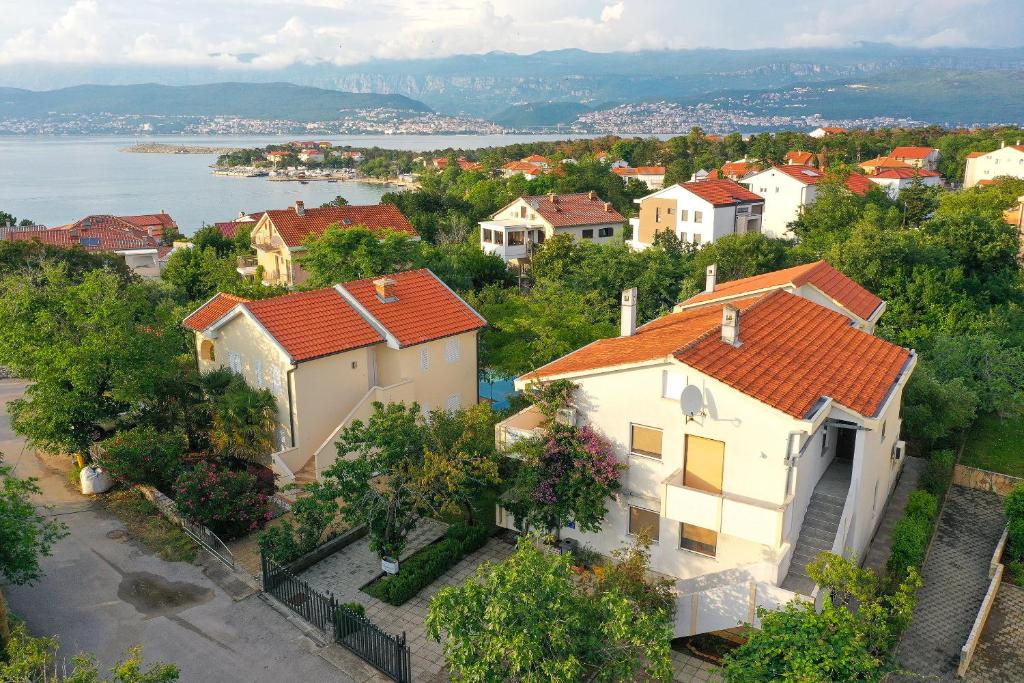 an aerial view of a town with houses at Apartments Villa Bernarda in Šilo