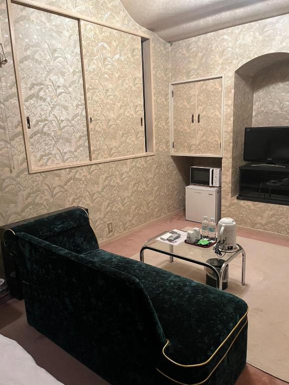 Kuchyň nebo kuchyňský kout v ubytování ロビンホテルRobin Hotel