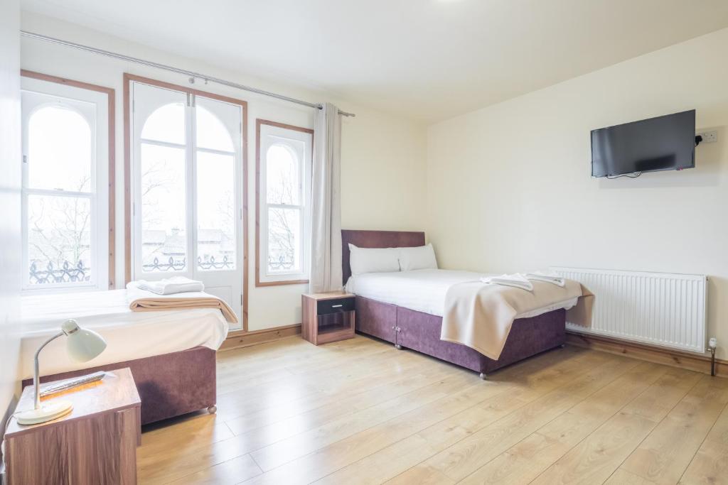 Postel nebo postele na pokoji v ubytování Rasa Sayang House - Self-check-in guesthouse