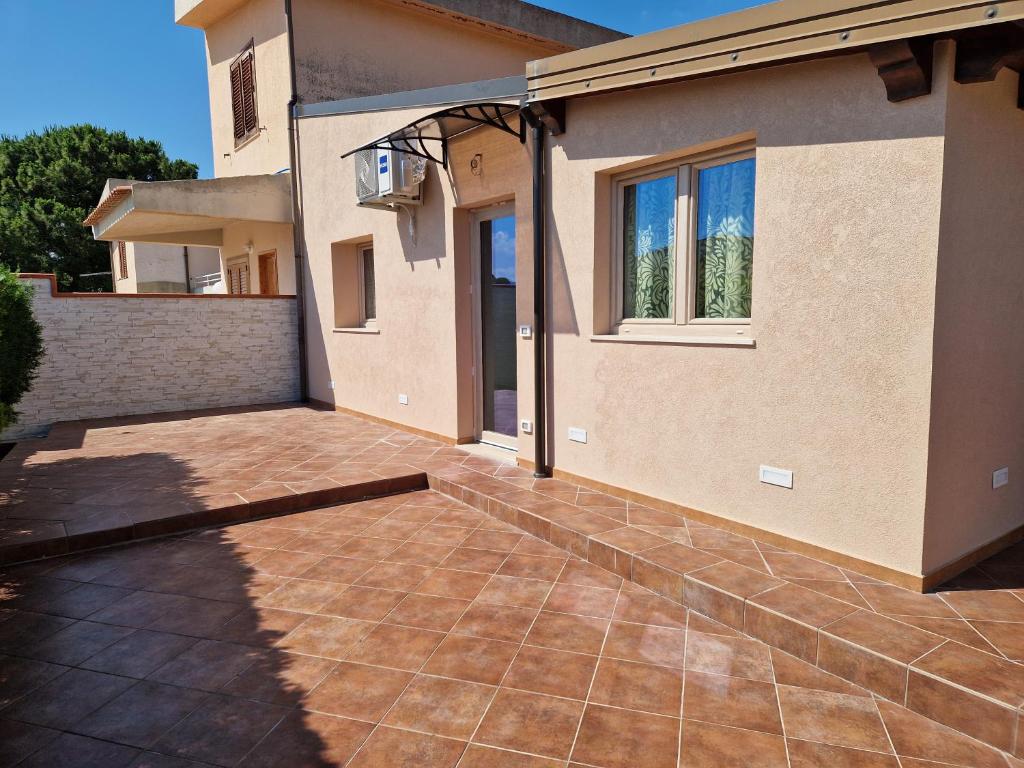 a patio in front of a house at Casa vacanze Villa Marta in Porto San Giorgio