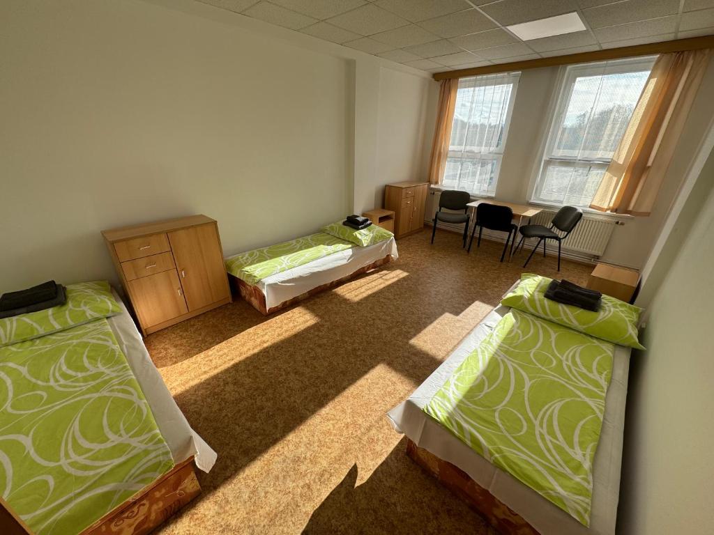Postel nebo postele na pokoji v ubytování D8 APARTMÁNY