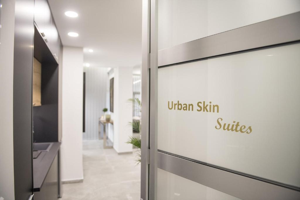 an office door with the words urban skin surfaces written on it at STAY Urban Skin Suite in Nicosia