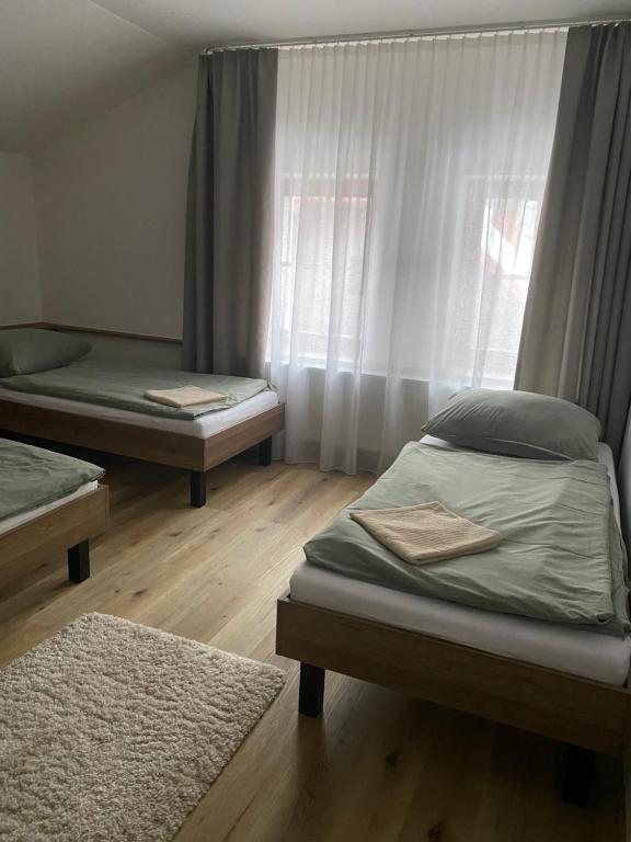 Postel nebo postele na pokoji v ubytování Penzion Aurelia Donovaly
