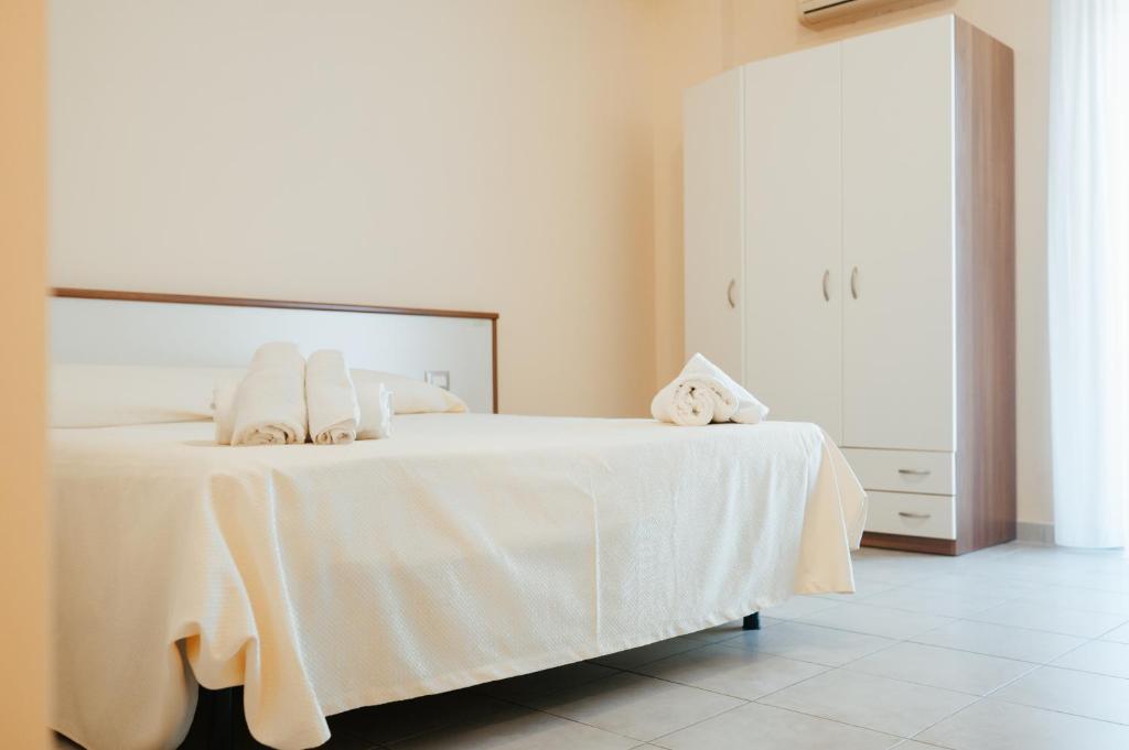 Postel nebo postele na pokoji v ubytování Hotel Parnaso