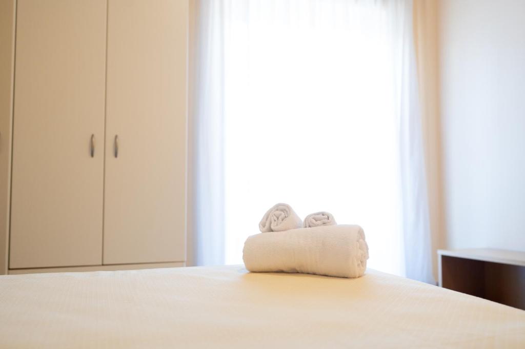 Postel nebo postele na pokoji v ubytování Hotel Parnaso