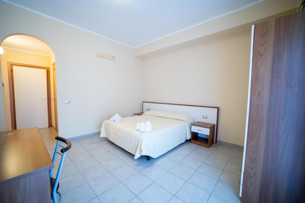 Postel nebo postele na pokoji v ubytování Hotel Parnaso