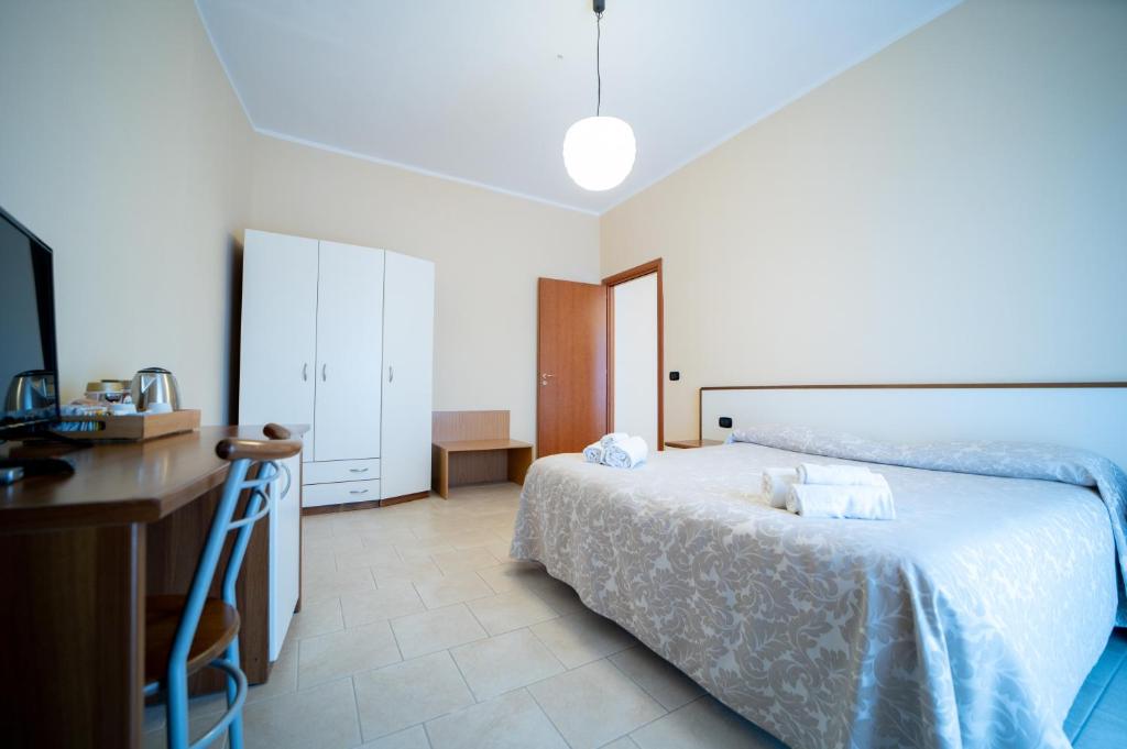 Postel nebo postele na pokoji v ubytování Hotel Parnaso