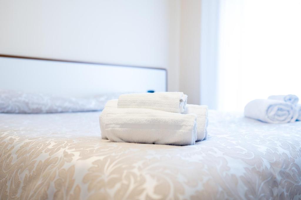 Postel nebo postele na pokoji v ubytování Hotel Parnaso