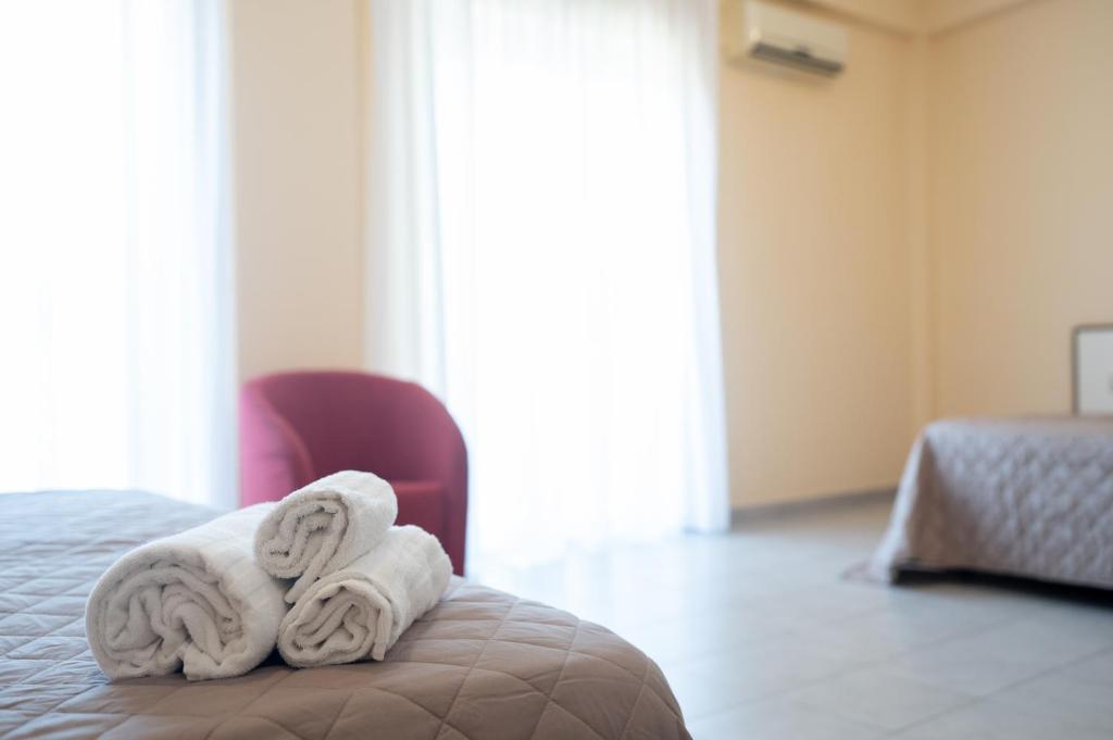 Postel nebo postele na pokoji v ubytování Hotel Parnaso