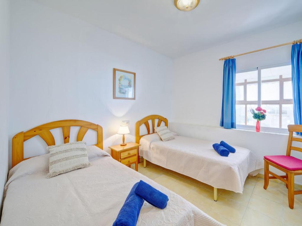 Postel nebo postele na pokoji v ubytování Apartment Raquel by Interhome