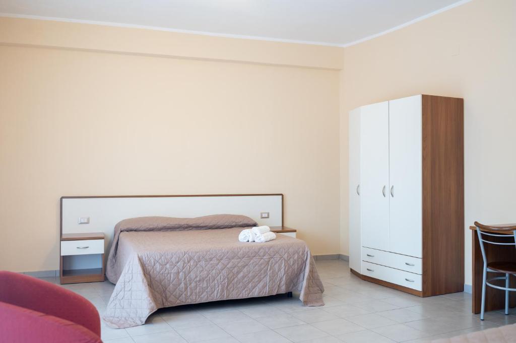 Postel nebo postele na pokoji v ubytování Hotel Parnaso