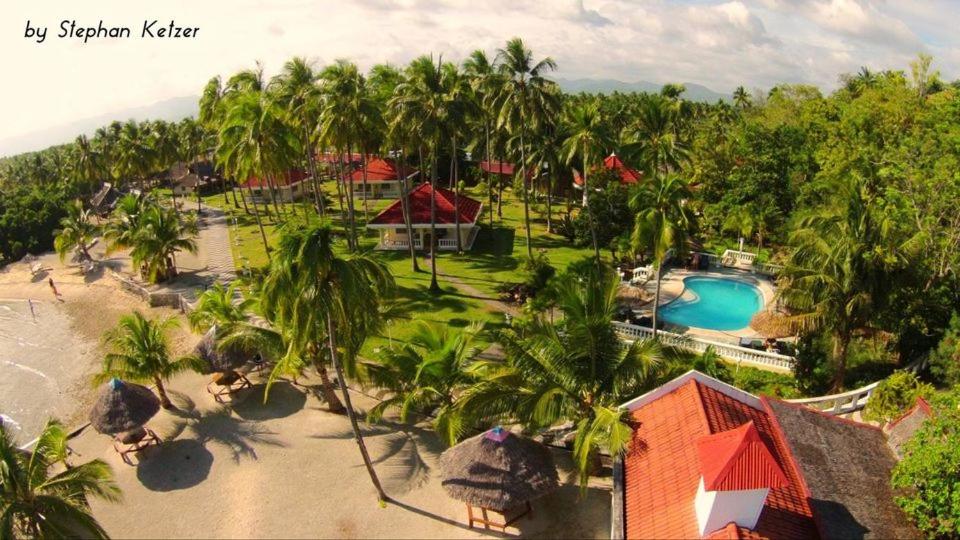 an aerial view of a resort with a swimming pool at Whispering Palms Island Resort in San Carlos