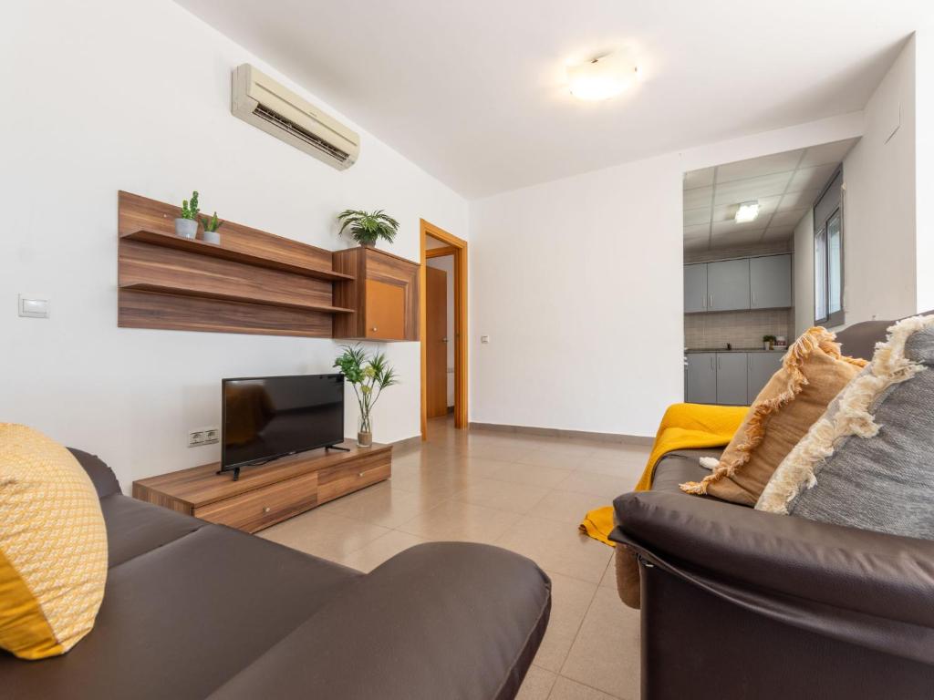 Televízia a/alebo spoločenská miestnosť v ubytovaní Holiday Home Gaviota 13 by Interhome