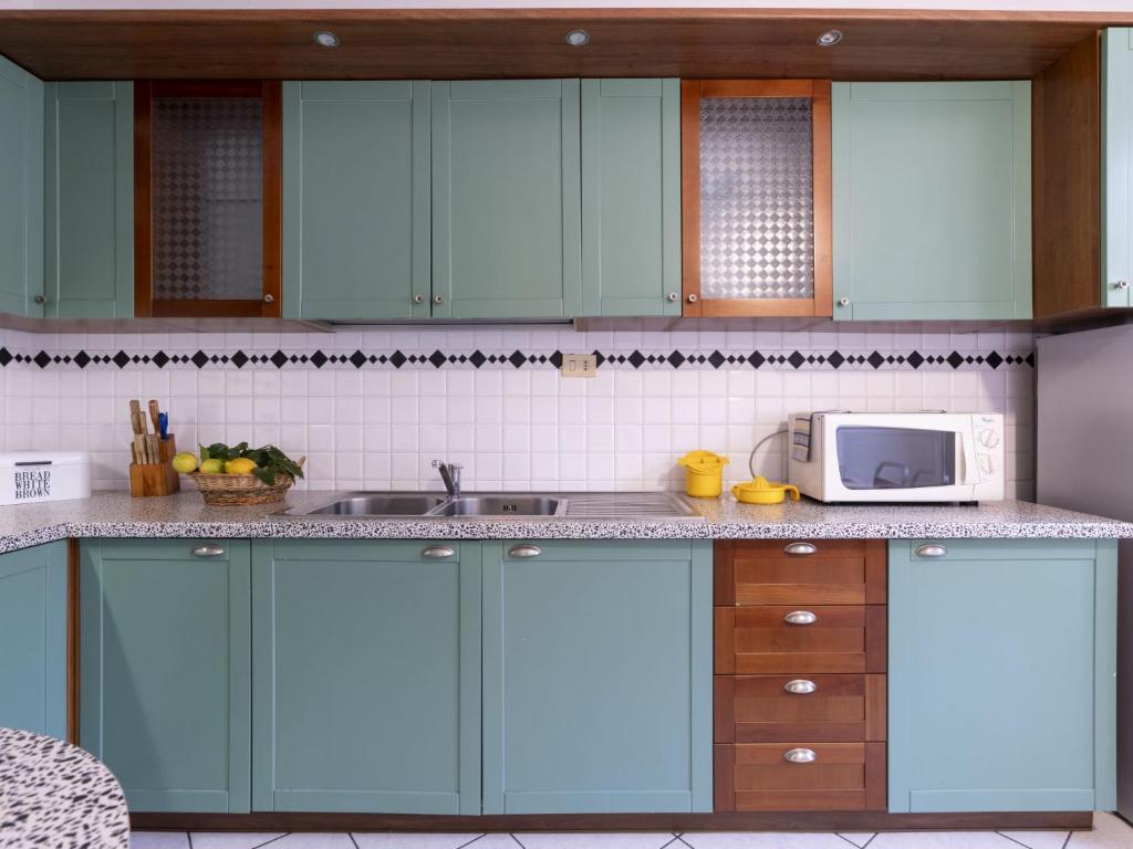 A kitchen or kitchenette at Apartment Gallesio - FLG213 by Interhome