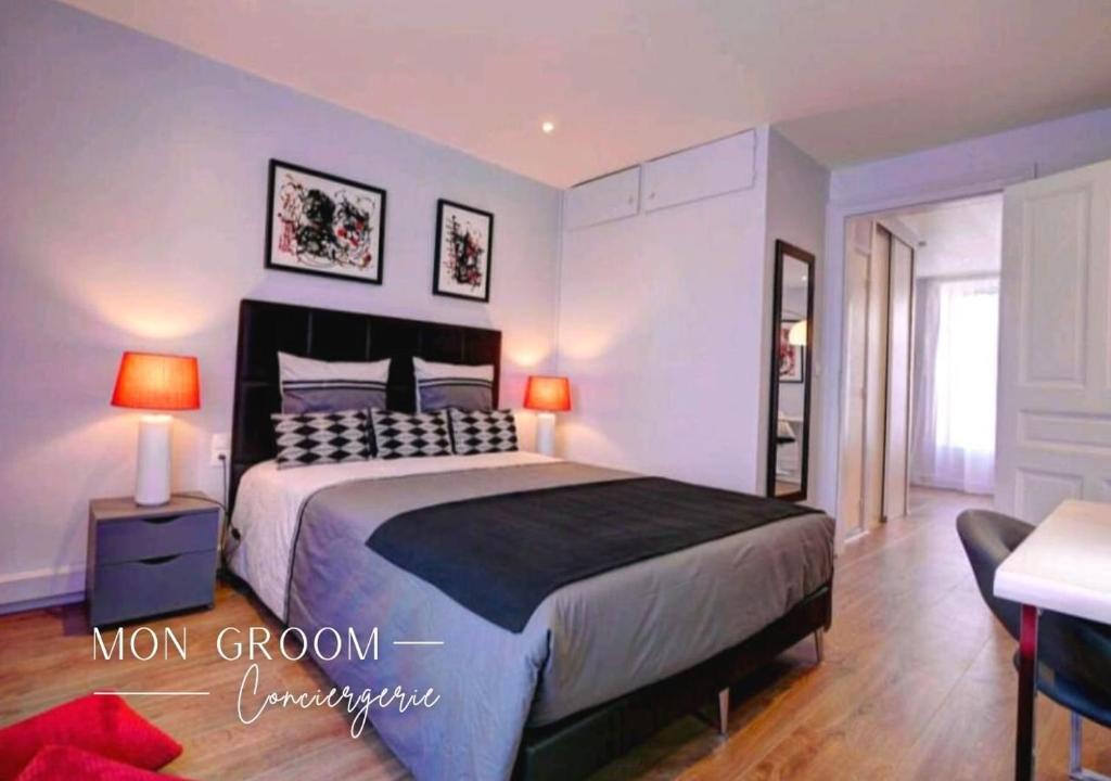 A bed or beds in a room at La Coccinelle - Appartement proche Centre-Ville - Cosy - Mon Groom