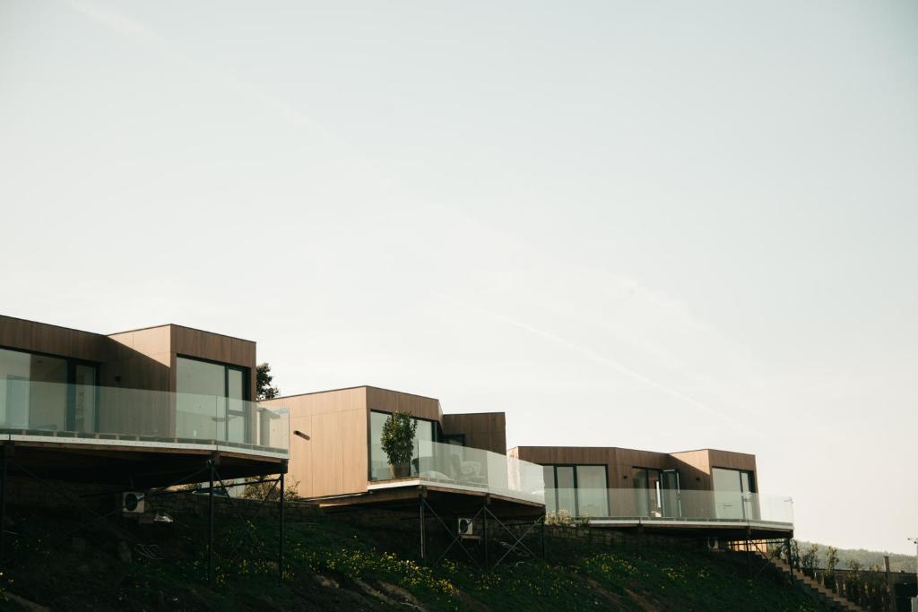 a building on the side of a hill at ESPAZO NATURE in Carballo