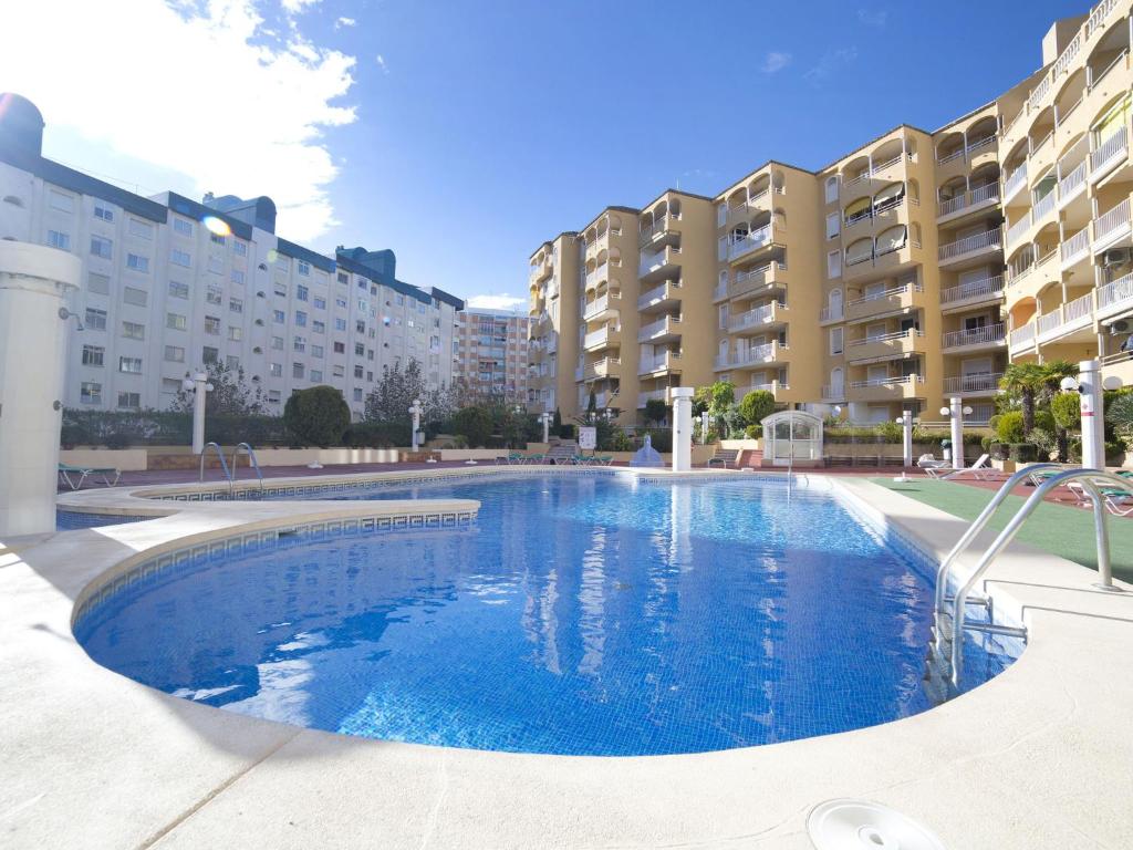 a large swimming pool in front of some buildings at Apartment Apolo VII-7 by Interhome in Calpe