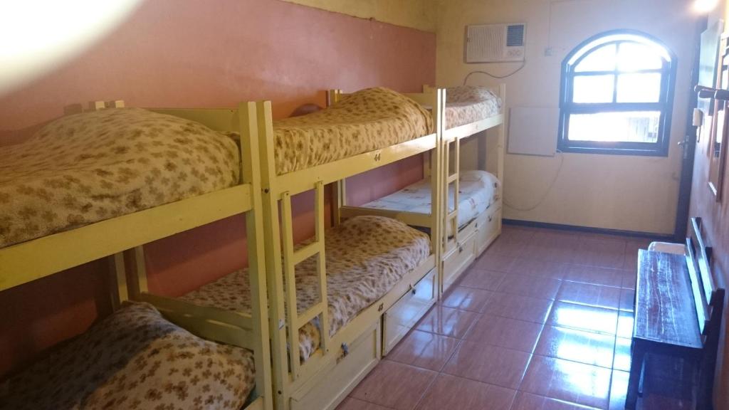 Postel nebo postele na pokoji v ubytování Hostel Iguazu Falls