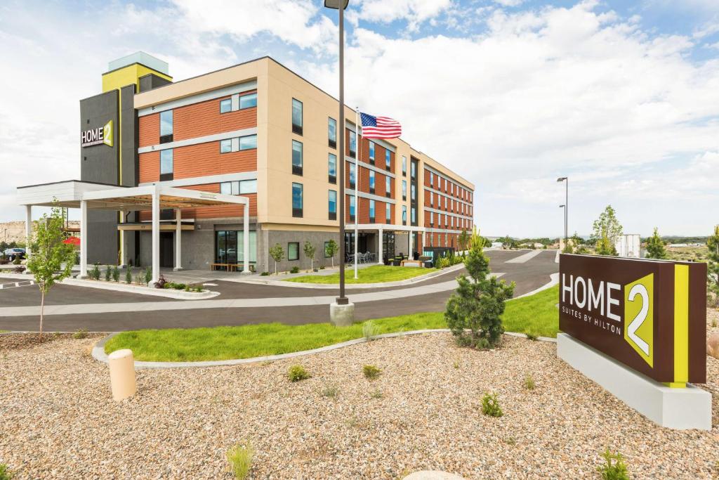 a building with a home depot sign in front of it at Home2 Suites by Hilton Farmington/Bloomfield in Farmington