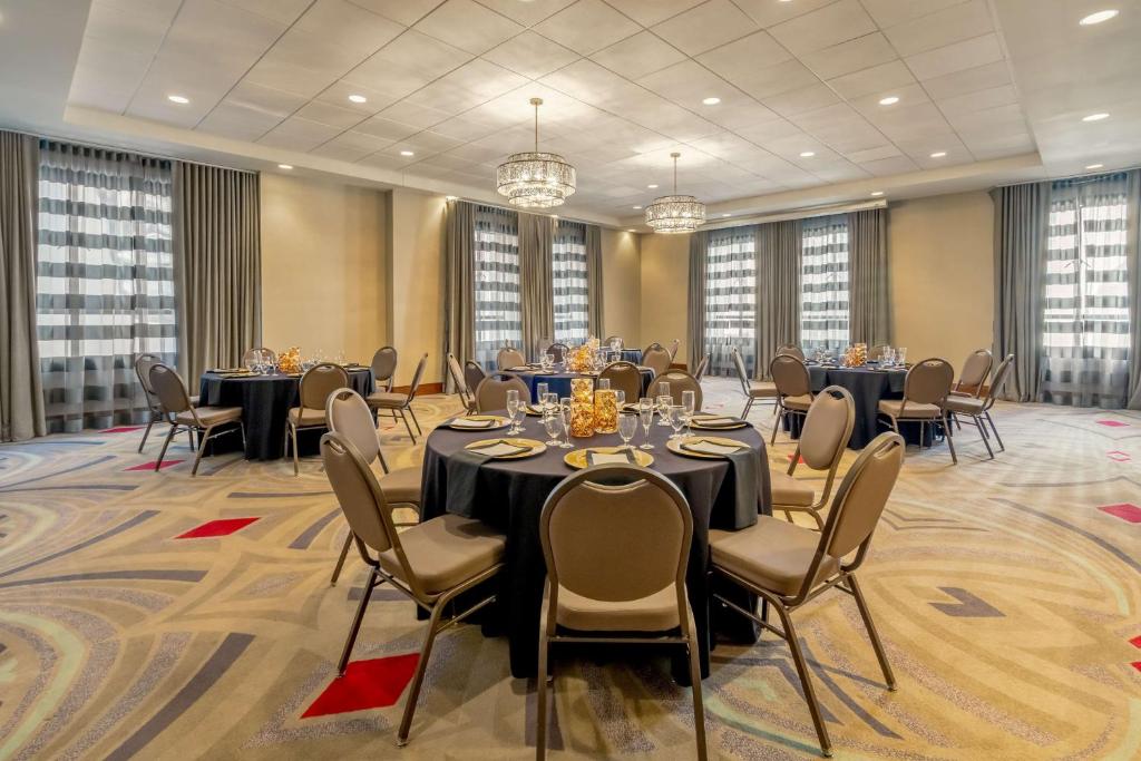 a conference room with tables and chairs and chandeliers at Hilton Garden Inn Phoenix Downtown in Phoenix